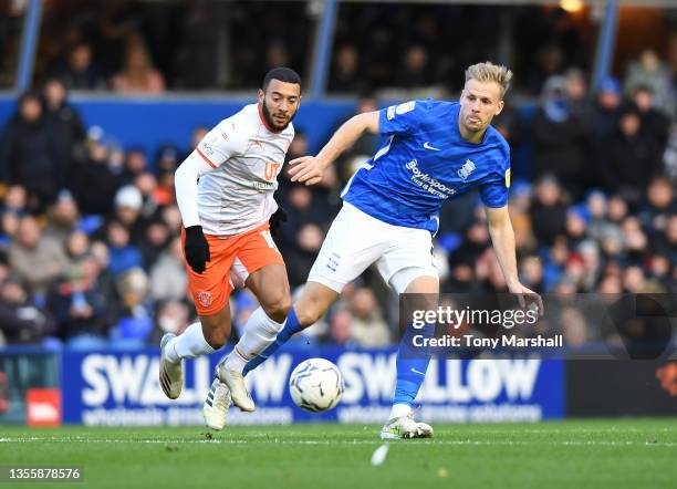 Marc Roberts of Birmingham City is challenged by Keshi Anderson of Blackpool during the Sky Bet Championship match between Birmingham City and...