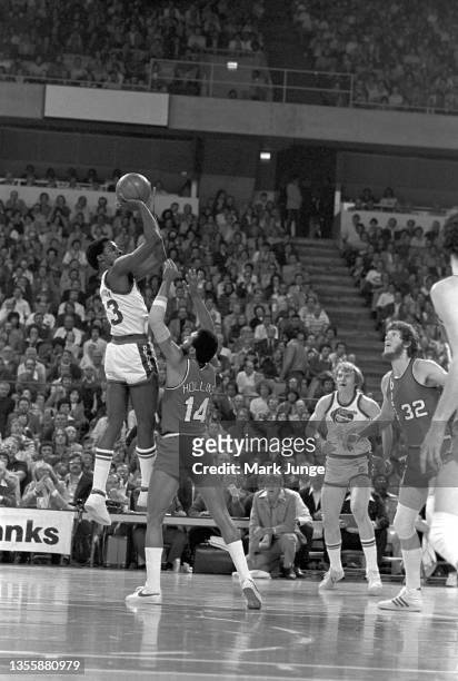 Denver Nuggets forward David Thompson releases his jump shot far above Portland Trail Blazers defender Lionel Hollins during an NBA playoff game at...