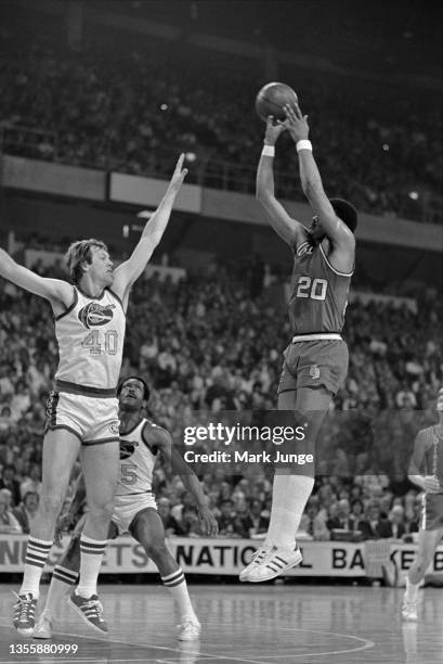 Portland Trail Blazers forward Maurice Lucas shoots a jumper over Denver Nuggets forward Byron Beck during an NBA playoff game at McNichols Arena on...