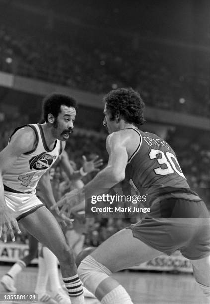 Denver Nuggets forward Willie Wise guards Portland Trail Blazers forward Bob Gross during an NBA playoff game at McNichols Arena on May 1, 1977 in...