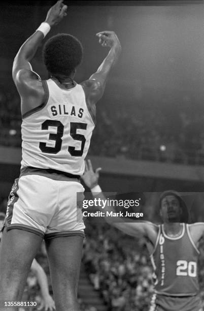 Denver Nuggets forward Paul Silas takes a shot over Portland Trail Blazers forward Maurice Lucas during an NBA playoff game at McNichols Arena on May...