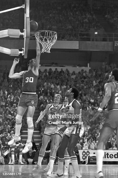 Portland Trail Blazers forward Bob Gross drives under the hoop for a layup during an NBA playoff game against the Denver Nuggets at McNichols Arena...