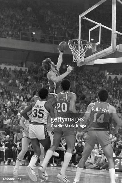 Portland Trail Blazers center Bill Walton puts up a layup against the Denver Nuggets during an NBA playoff game at McNichols Arena on May 1, 1977 in...