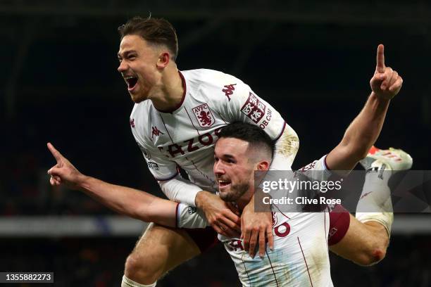 John McGinn of Aston Villa celebrates with teammate Matty Cash after scoring their side's second goal during the Premier League match between Crystal...