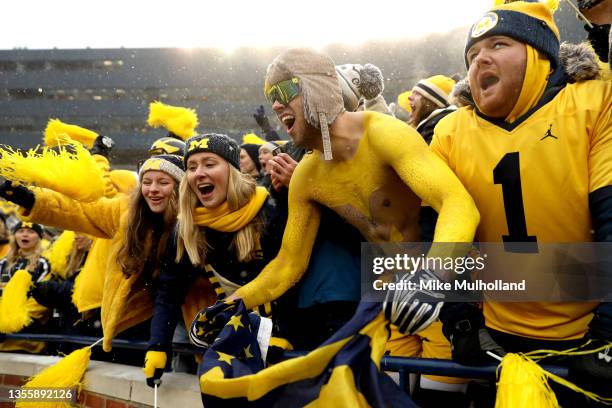 Michigan fans cheer from the stands in the second half of the game against the Ohio State Buckeyes at Michigan Stadium on November 27, 2021 in Ann...
