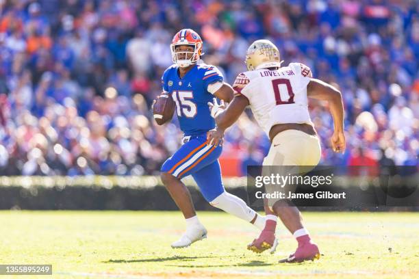 Anthony Richardson of the Florida Gators looks to pass against Fabien Lovett of the Florida State Seminoles during the third quarter of a game at Ben...