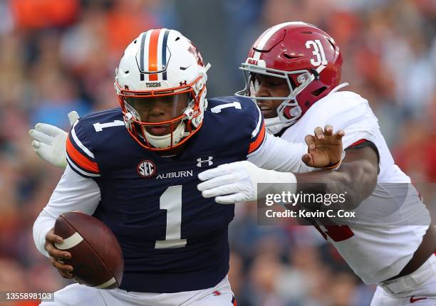 Will Anderson Jr. #31 of the Alabama Crimson Tide sacks TJ Finley of the Auburn Tigers during the first half at Jordan-Hare Stadium on November 27,...