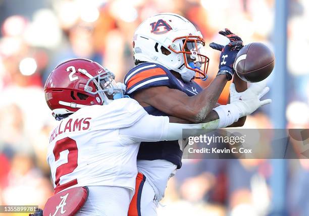 Ja'Varrius Johnson of the Auburn Tigers fails to pull in this reception against DeMarcco Hellams of the Alabama Crimson Tide during the first half at...