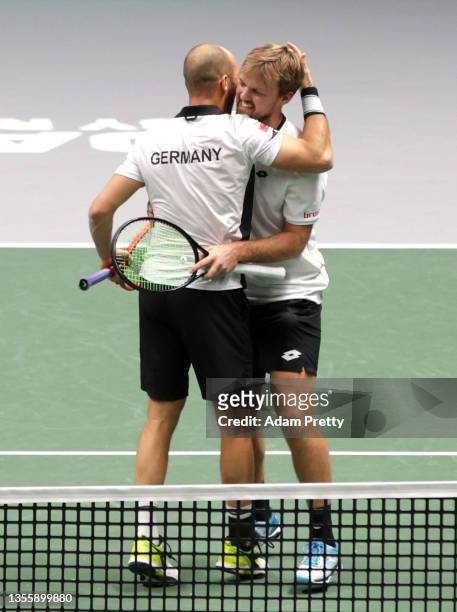 Kevin Krawietz and Tim Puetz of Germany celebrate victory following the Davis Cup match between Novak Djokovic and Nikola Cacic of Serbia and Kevin...