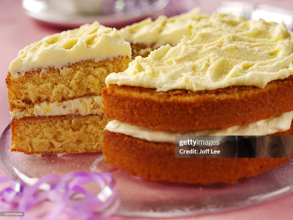 Orange sponge cake with frosting, close up