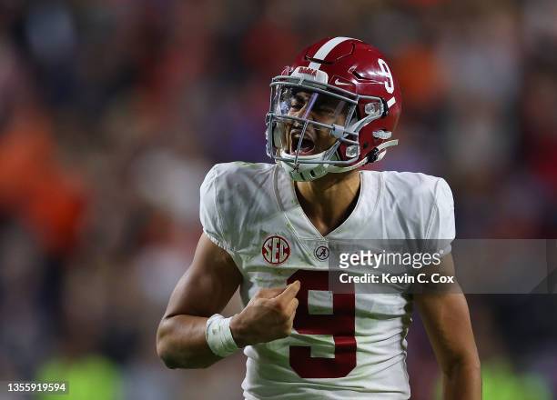 Bryce Young of the Alabama Crimson Tide reacts after passing for a touchdown at the end of the second half against the Auburn Tigers at Jordan-Hare...