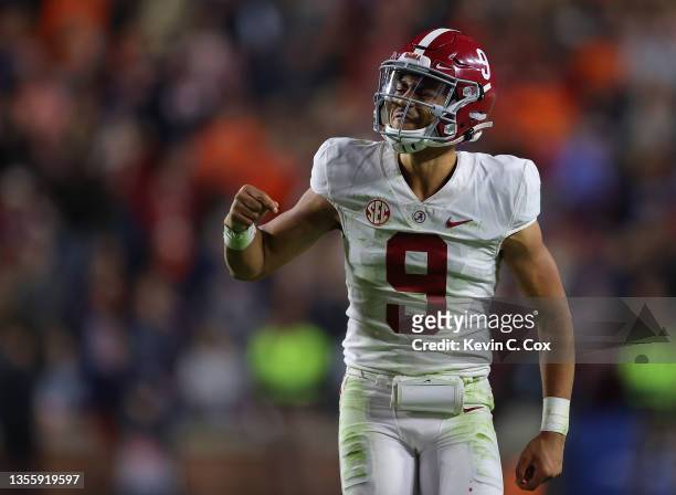 Bryce Young of the Alabama Crimson Tide reacts after passing for a touchdown at the end of the second half against the Auburn Tigers at Jordan-Hare...