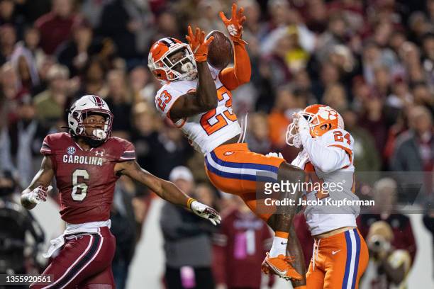 Cornerback Andrew Booth Jr. #23 of the Clemson Tigers makes an interception on a pass intended for wide receiver Josh Vann of the South Carolina...