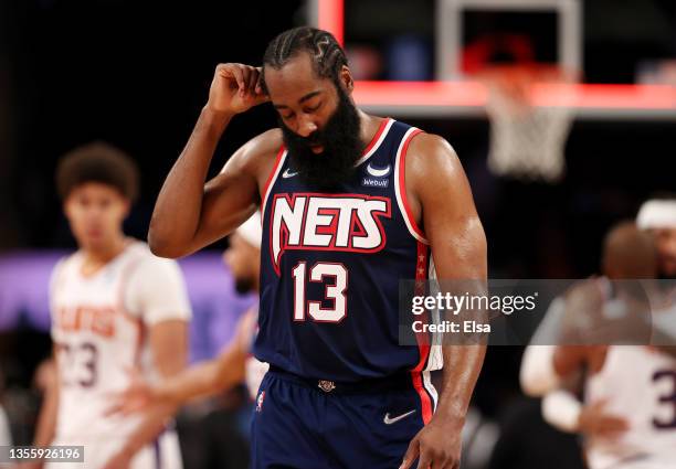 James Harden of the Brooklyn Nets walks off the court after the loss to the Phoenix Suns at Barclays Center on November 27, 2021 in New York City....