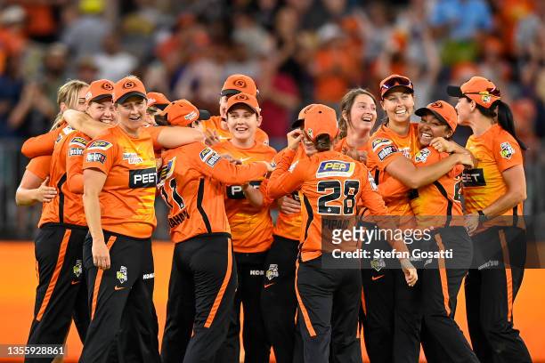 The Scorchers celebrate after winning the Final of the Women's Big Bash League match between the Perth Scorchers and the Adelaide Strikers at Optus...