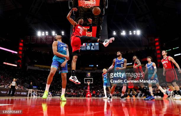 Christian Wood of the Houston Rockets dunks the ball during the first half against the Charlotte Hornets at Toyota Center on November 27, 2021 in...
