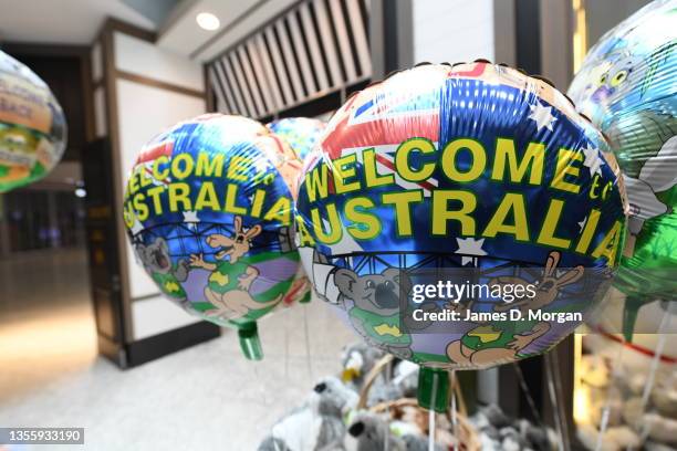 Welcome to Australia balloons on sale inside a gift store at Sydney International Airport on November 28, 2021 in Sydney, Australia. NSW Health...