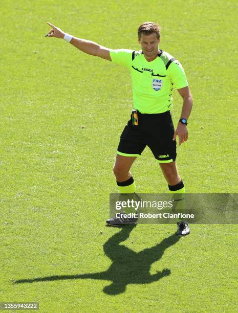 Referee Alex King gestures during the A-League match between Melbourne Victory and Brisbane Roar at AAMI Park, on November 28 in Melbourne, Australia.