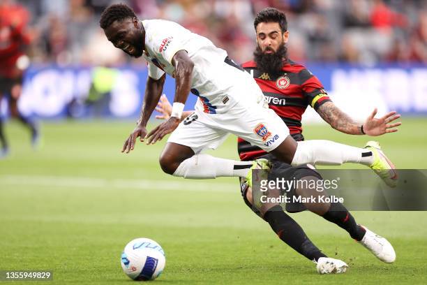 Olivier Boumal of the Jets is fouled in the box by Rhys Williams of the Wanderers during the A-League match between Western Sydney Wanderers and...