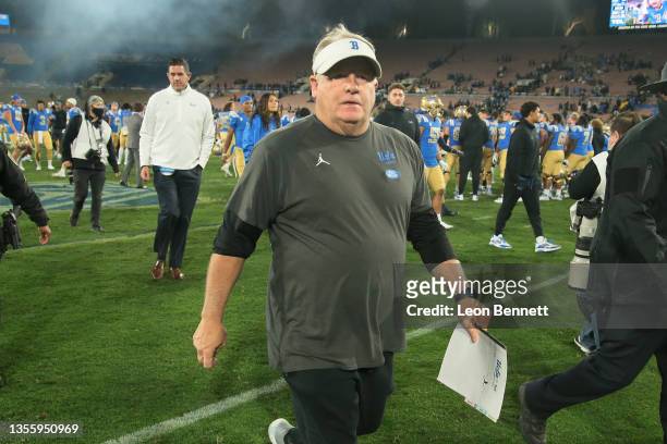 Head coach Chip Kelly of the UCLA Bruins walks off the field after a 42-14 win over the California Golden Bears at Rose Bowl on November 27, 2021 in...