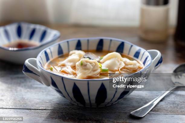 chinese dumpling and noodles, cooked with broth - noodle soup stock pictures, royalty-free photos & images