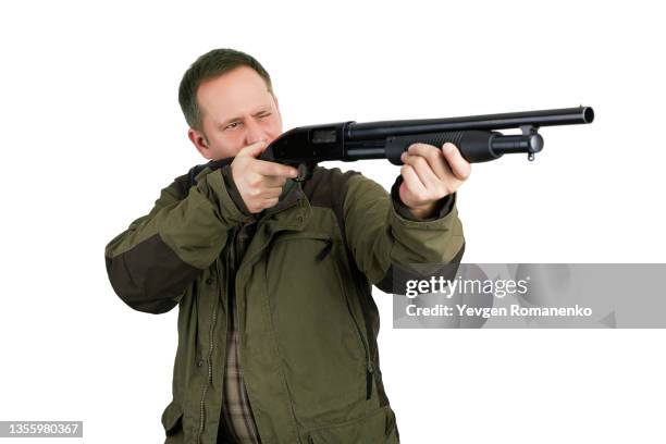 hunter with a shotgun isolated on white background - revolver-with-silencer stock-fotos und bilder