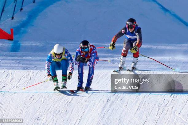 Sergey Ridzik of Russia, Bastien Midol of Fance and Brady Leman of Canada compete in the men's ski cross during the FIS Ski Cross World Cup 2022,...