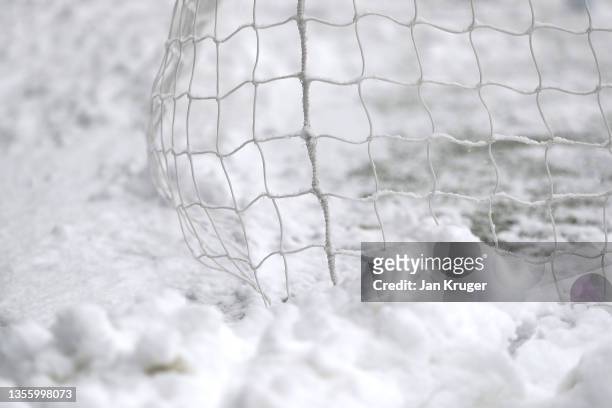 Detailed ivew of snow piled up in the goalmouth after the Premier League match between Burnley and Tottenham Hotspur is postponed due to a frozen...