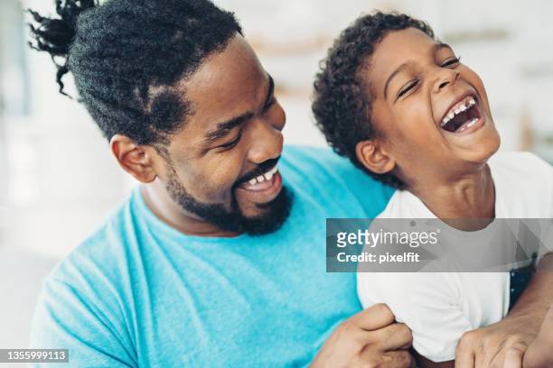 father and son happy together - tickling stock pictures, royalty-free photos & images