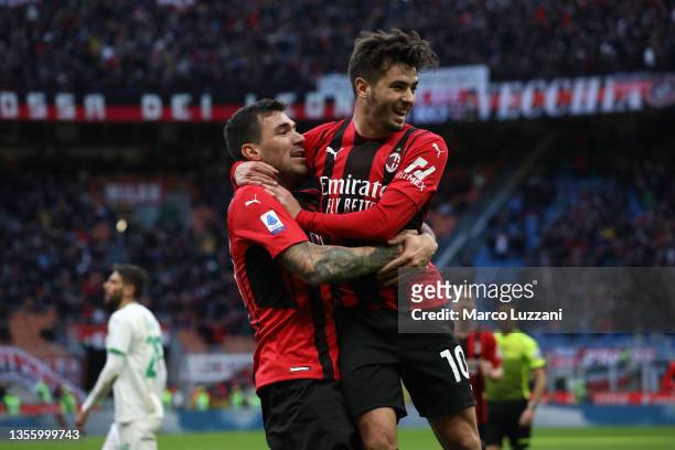 Alessio Romagnoli of AC Milan celebrates with teammate Brahim Diaz after scoring their side's first goal during the Serie A match between AC Milan...