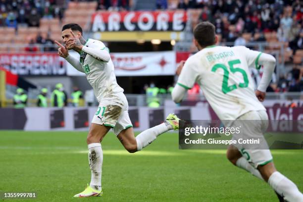 Gianluca Scamacca of US Sassuolo celebrates after scoring the his team's first goal during the Serie A match between AC Milan and US Sassuolo at...
