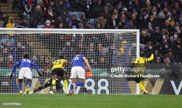 Joshua King of Watford FC scores their side's first goal from the penalty spot during the Premier League match between Leicester City and Watford at...