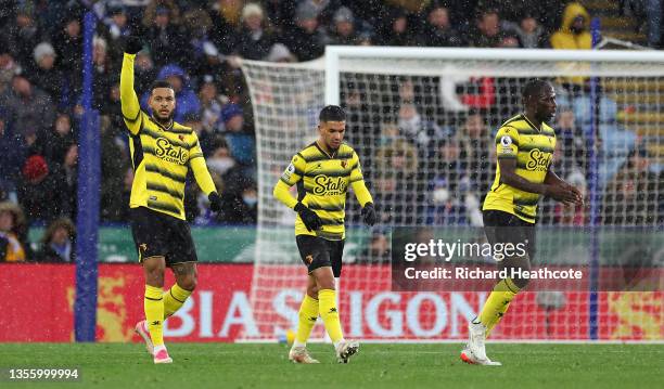 Joshua King of Watford FC celebrates after scoring their side's first goal from the penalty spot during the Premier League match between Leicester...