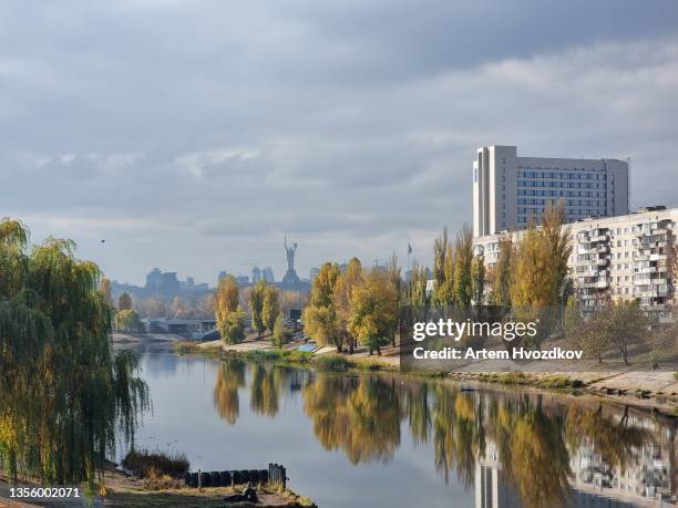 silhouette of motherland monument  standings on the horizon of kyiv city landscape - autumn kyiv stock pictures, royalty-free photos & images