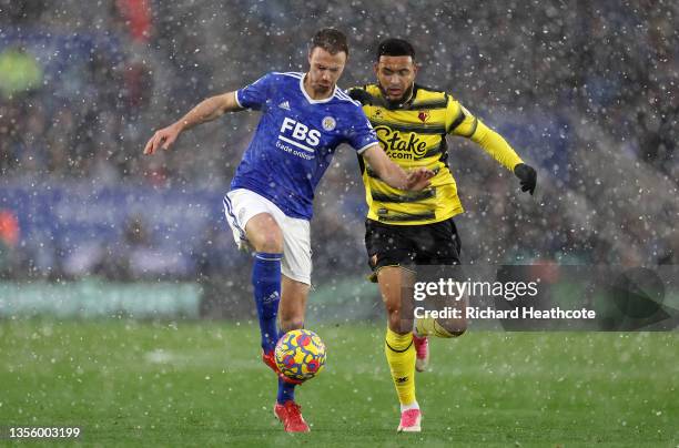 Jonny Evans of Leicester City and Joshua King of Watford FC battle for possession during the Premier League match between Leicester City and Watford...