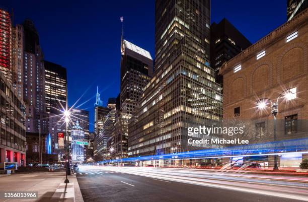 park avenue light trails in midtown manhattan - new york - park ave stock pictures, royalty-free photos & images
