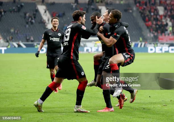 Obite Evan Ndicka of Eintracht Frankfurt celebrates his 2-1 goal with teammates during the Bundesliga match between Eintracht Frankfurt and 1. FC...