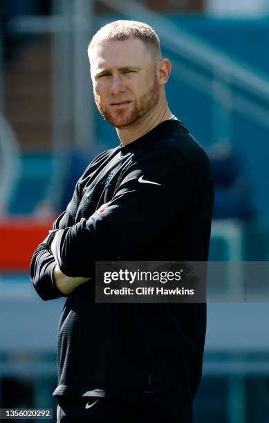 Offensive Coordinator Joe Brady Carolina Panthers looks on during pregame warm-ups before the game against the Miami Dolphins at Hard Rock Stadium on...