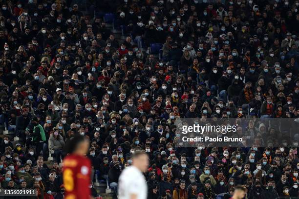 Fans wear face masks during the Serie A match between AS Roma and Torino FC at Stadio Olimpico on November 28, 2021 in Rome, Italy.