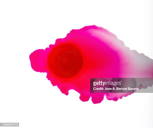 drop of pink paint slides on a blank canvas. - image technique stock pictures, royalty-free photos & images