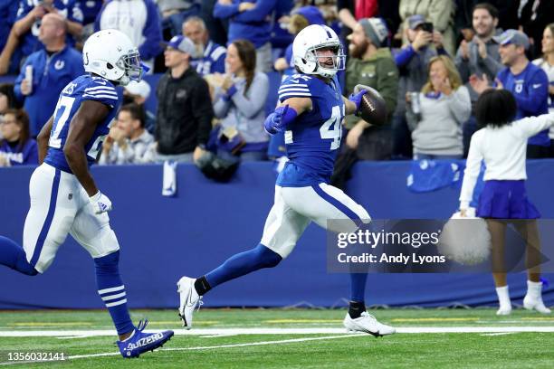 Andrew Sendejo of the Indianapolis Colts celebrates a fumble recovery in the first half of the game against the Tampa Bay Buccaneers at Lucas Oil...