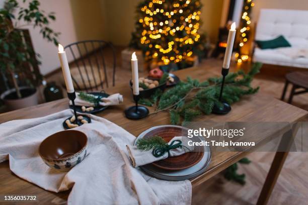 christmas and new year table setting in scandinavian style with in natural decorations. minimal christmas. zero waste - table setting design scandinavian imagens e fotografias de stock
