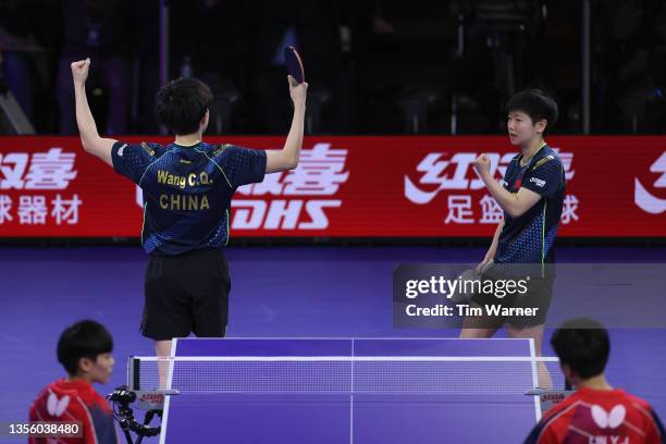 Wang Chuqin and Sun Yingsha of China react after defeating Lin Yun-Ju and Cheng I-Ching of Chinese Taipei during the mixed doubles semifinals match...