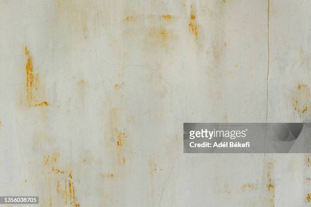 corroded beige metal board - nieten stock-fotos und bilder