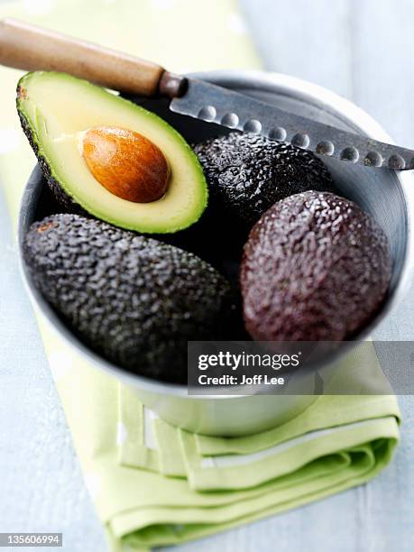 avocados (persea americana) - advocado stock pictures, royalty-free photos & images