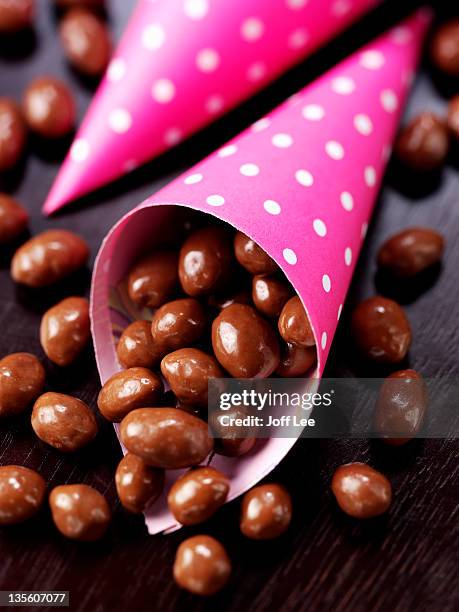 chocolate peanuts and raisins - raisin stock pictures, royalty-free photos & images