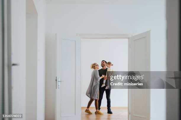 happy family moving in new home - family wide angle stock pictures, royalty-free photos & images