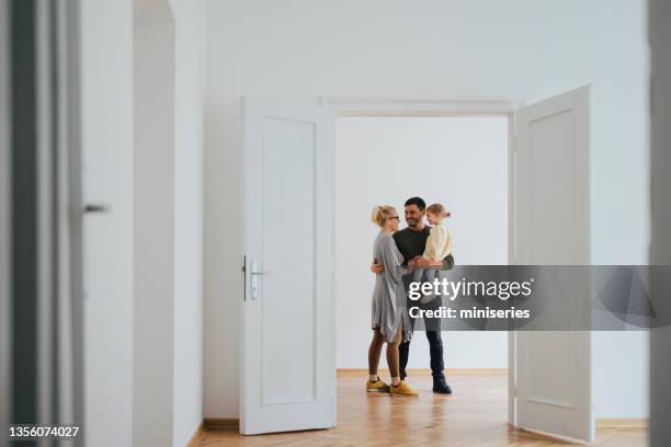 happy family moving in new home - family wide angle stock pictures, royalty-free photos & images