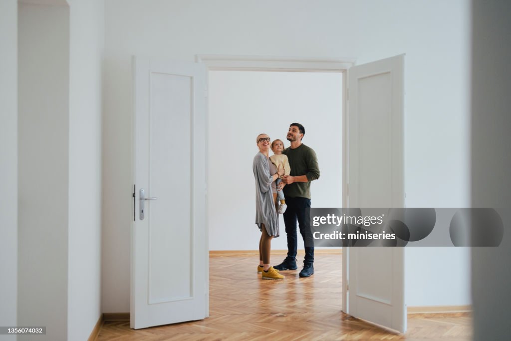 Excited Family Moving In New Home