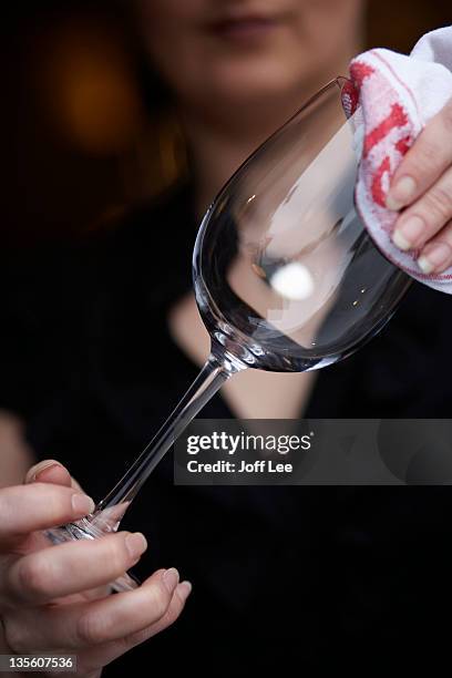 polishing a wine glass - polishing glasses stock pictures, royalty-free photos & images